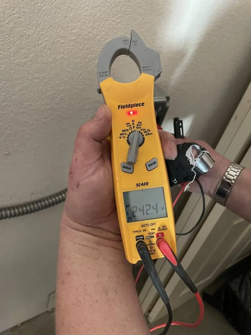 Voltage testing with clamp meter during Electrical Installation Services in San Elizario